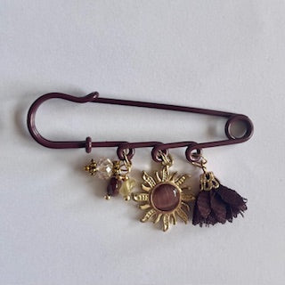 speld broche brown