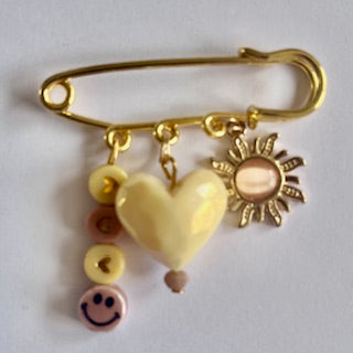 speld broche summer