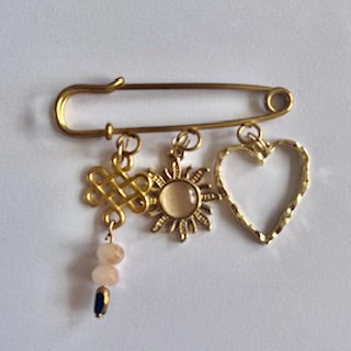 speld broche golden sun