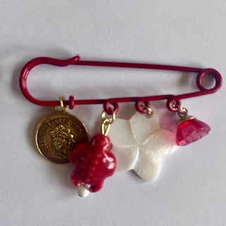 speld broche rood